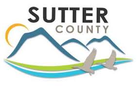 Sutter County logo:  the Sutter Buttes, sun, and geese.
